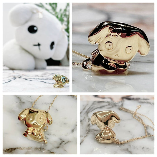 Custom pure silver pendant featuring BuBu the white dog, transformed from a 20-year-old wool doll with 18K gold electroplating