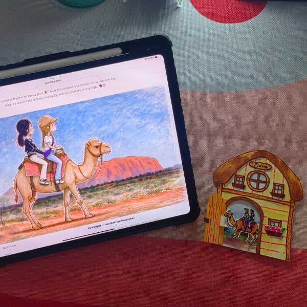 Handcrafted cottage watercolor NFC card beside a tablet displaying a matching custom animated keepsake story 