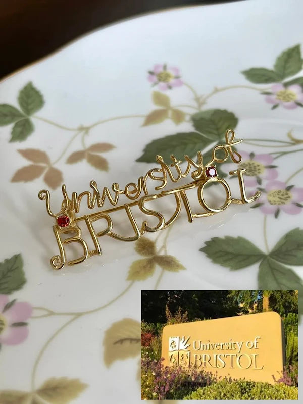Custom wire-wrapped jewelry with Bristol University crest